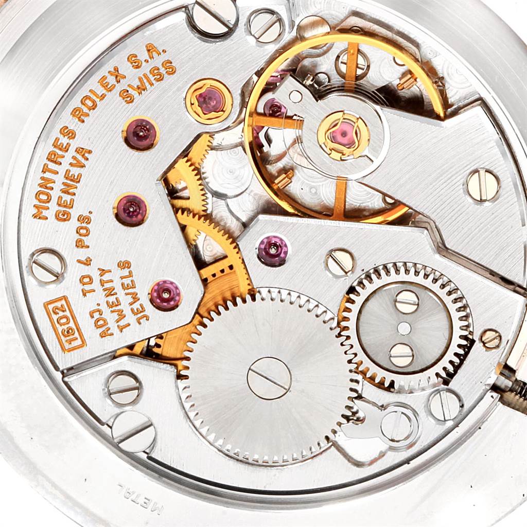 This is an internal close-up of the movement of a Rolex Cellini 5112 Men's Yellow Gold Beige Dial 5112 Men's Yellow Gold Beige Dial watch, showcasing its gears and mechanisms.