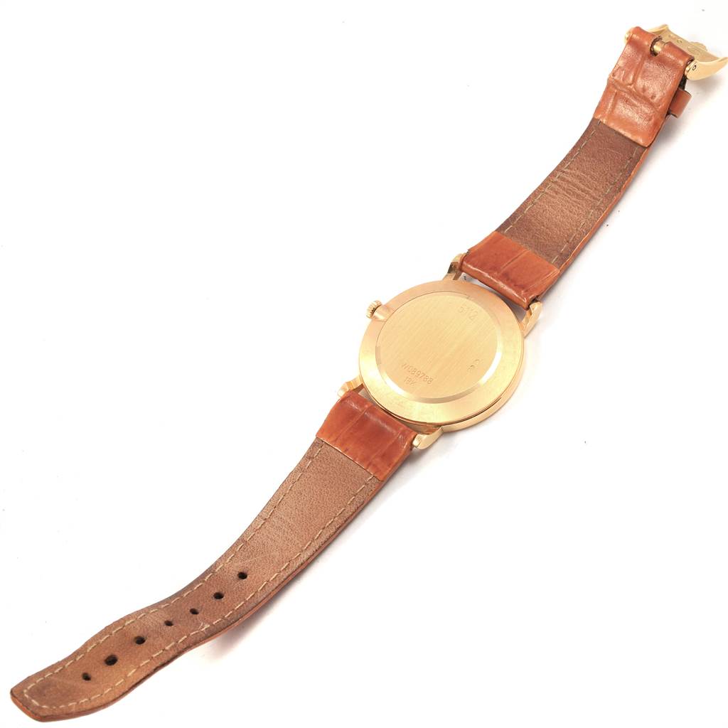 This image shows the back of the Rolex Cellini 5112 Men's Yellow Gold Beige Dial 5112 Men's Yellow Gold Beige Dial watch with a brown leather strap, photographed from above.