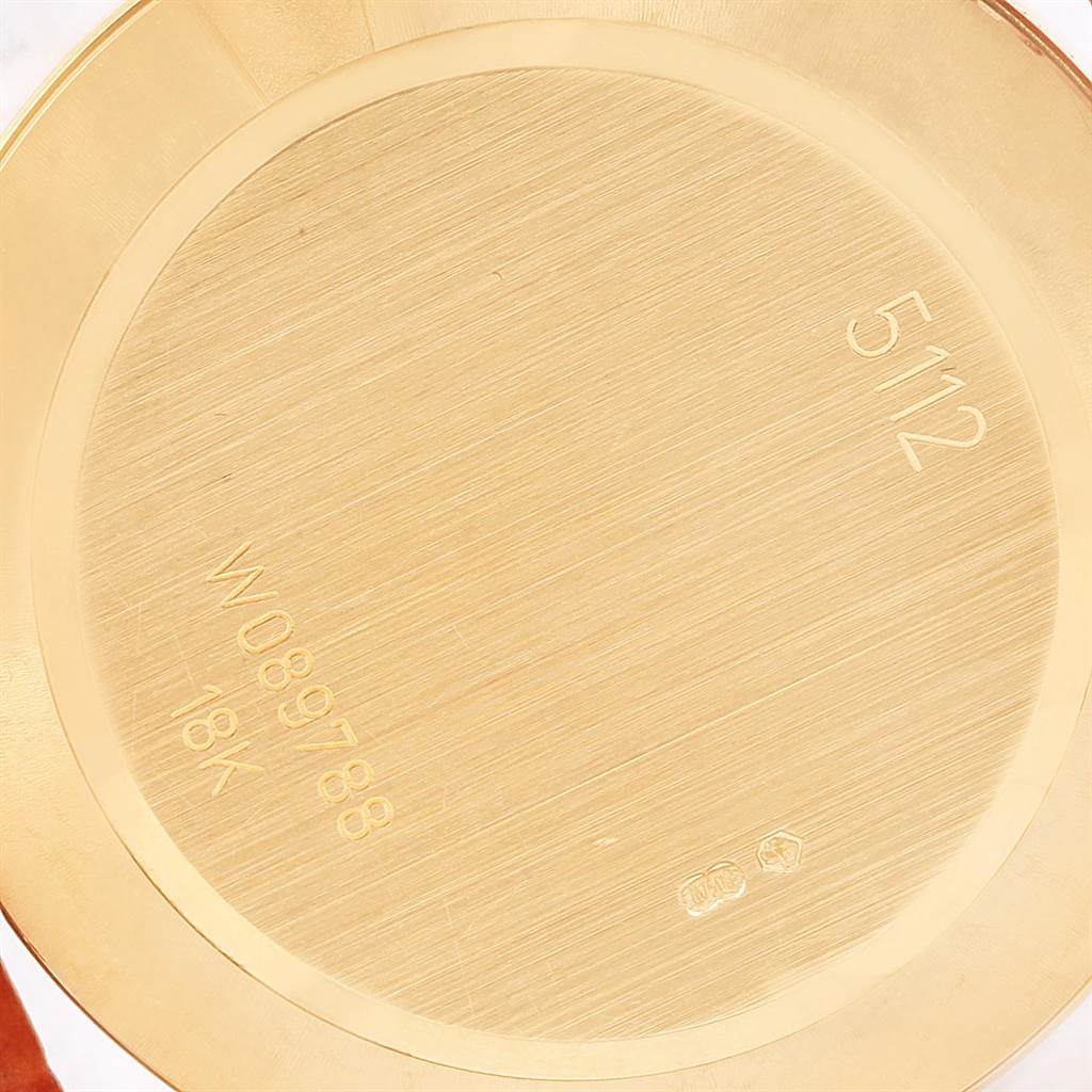 This image shows the case back of a Rolex Cellini 5112 Men's Yellow Gold Beige Dial 5112 Men's Yellow Gold Beige Dial watch, featuring engraved model and serial numbers.