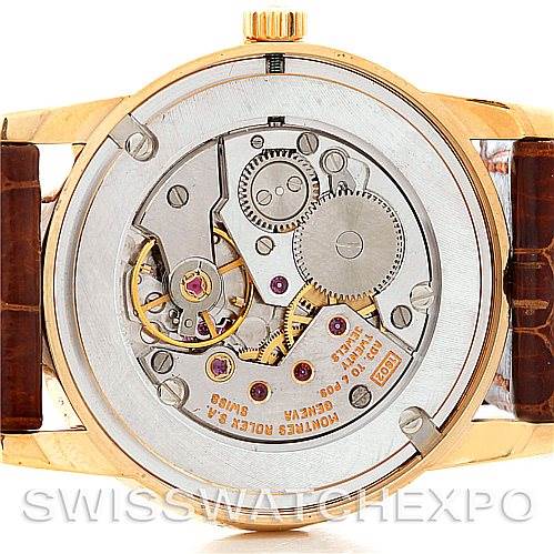 This image shows the back of a Rolex Cellini 5116 Men's Yellow Gold Beige Dial 5116 Men's Yellow Gold Beige Dial model watch, highlighting its movement and internal mechanisms.