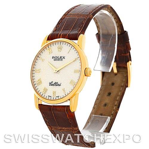 The image shows a Rolex Cellini 5116 Men's Yellow Gold Beige Dial 5116 Men's Yellow Gold Beige Dial watch at a three-quarter angle, highlighting its gold case, textured dial, and brown leather strap.