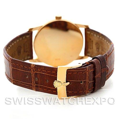 The image shows the back view of a Rolex Cellini 5116 Men's Yellow Gold Beige Dial 5116 Men's Yellow Gold Beige Dial watch, highlighting the leather strap and gold clasp.