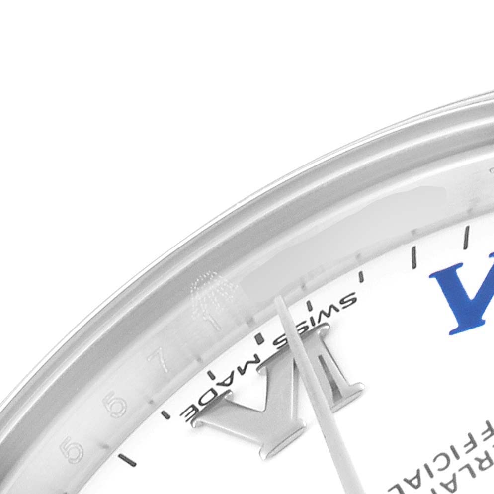 This image shows a close-up of the dial and bezel edge of a Mid-Size Rolex watch, highlighting the numerals and the "Swiss Made" text.