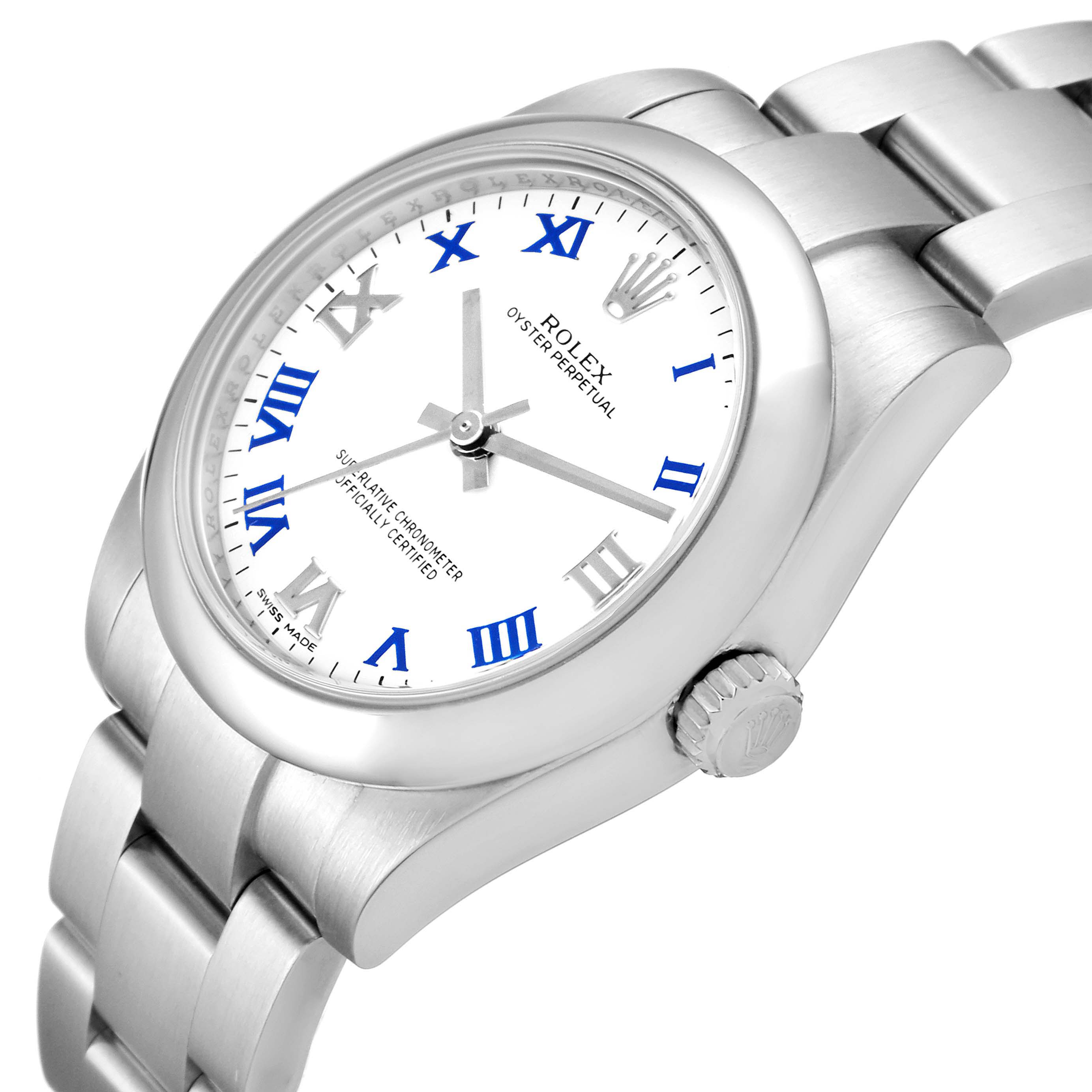 The image shows a Rolex Oyster Perpetual Mid-Size watch at a slight angle, highlighting its dial, crown, and part of the bracelet.