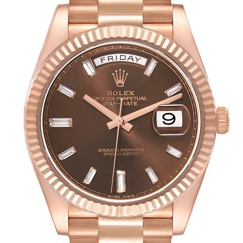 The Rolex President 228235 Men's Rose Gold Brown Dial 228235 Men's Rose Gold Brown Dial model is shown from a front view, highlighting the dial, day-date display, bezel, and part of the bracelet.