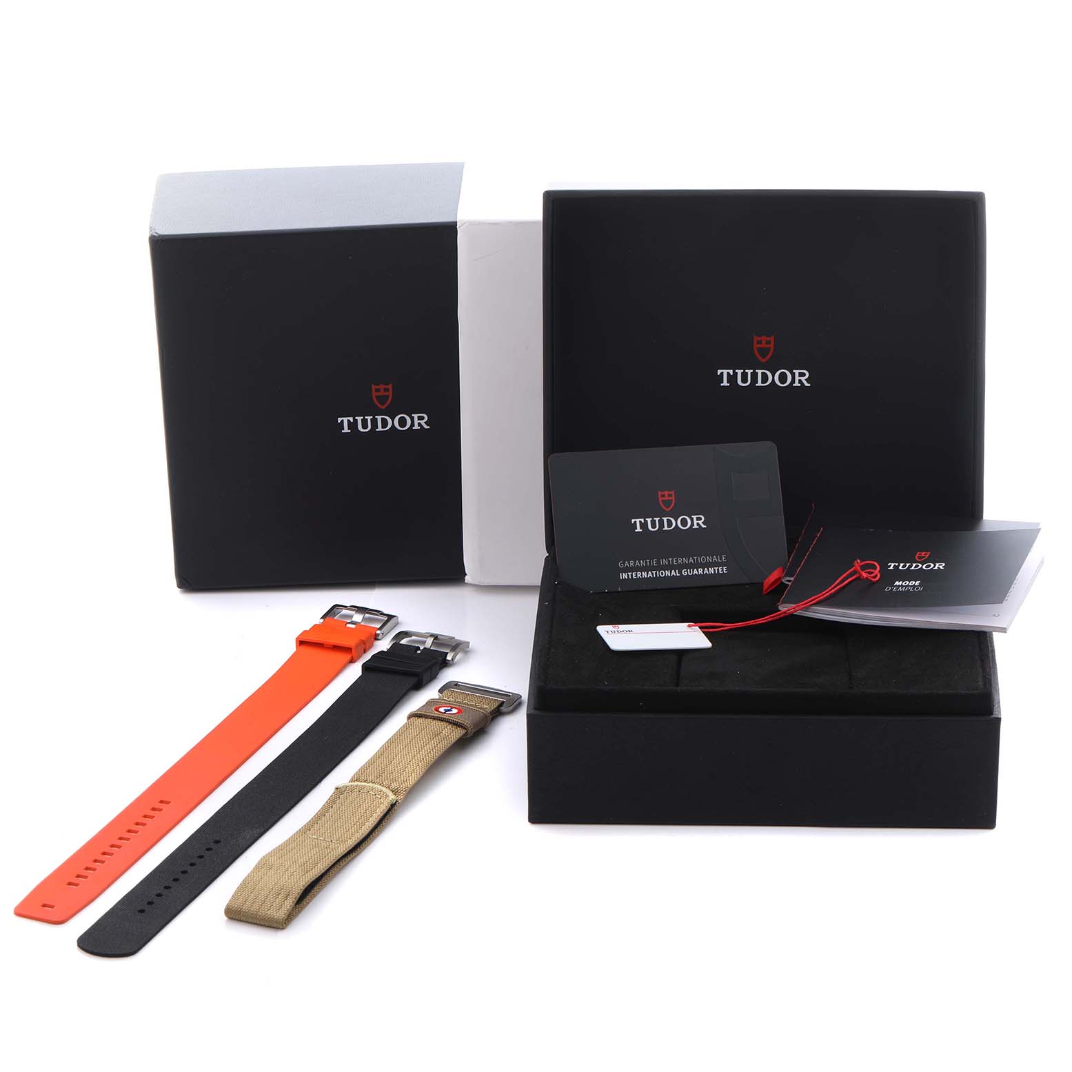 The image shows Tudor Pelagos 2542G247NU-0001 Men's Titanium Black Dial 2542G247NU-0001 Men's Titanium Black Dial watch accessories, including multiple straps and packaging, viewed from a top angle.