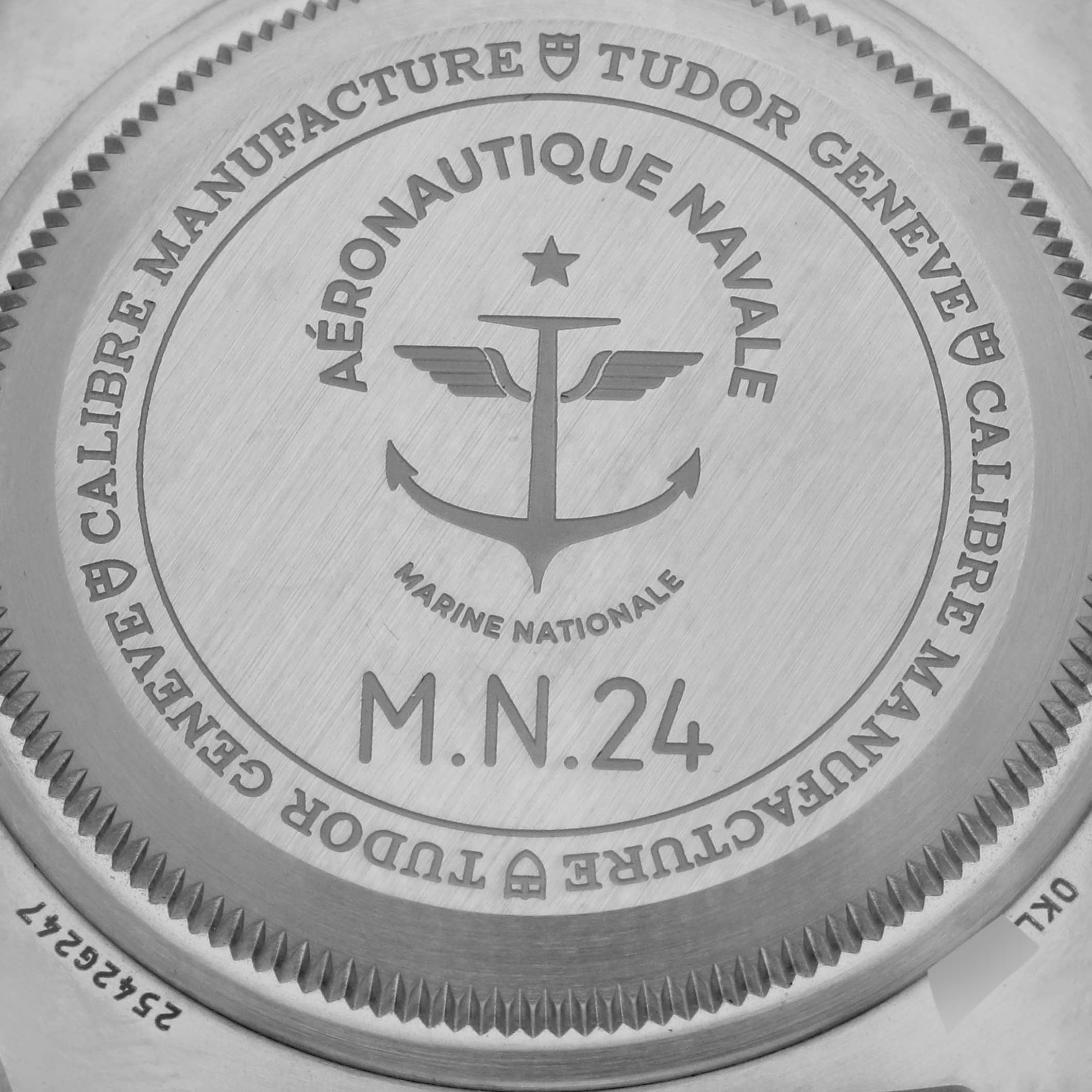 The image shows the engraved case back of the Tudor Pelagos 2542G247NU-0001 Men's Titanium Black Dial 2542G247NU-0001 Men's Titanium Black Dial watch, focusing on the collaborative Marine Nationale details.