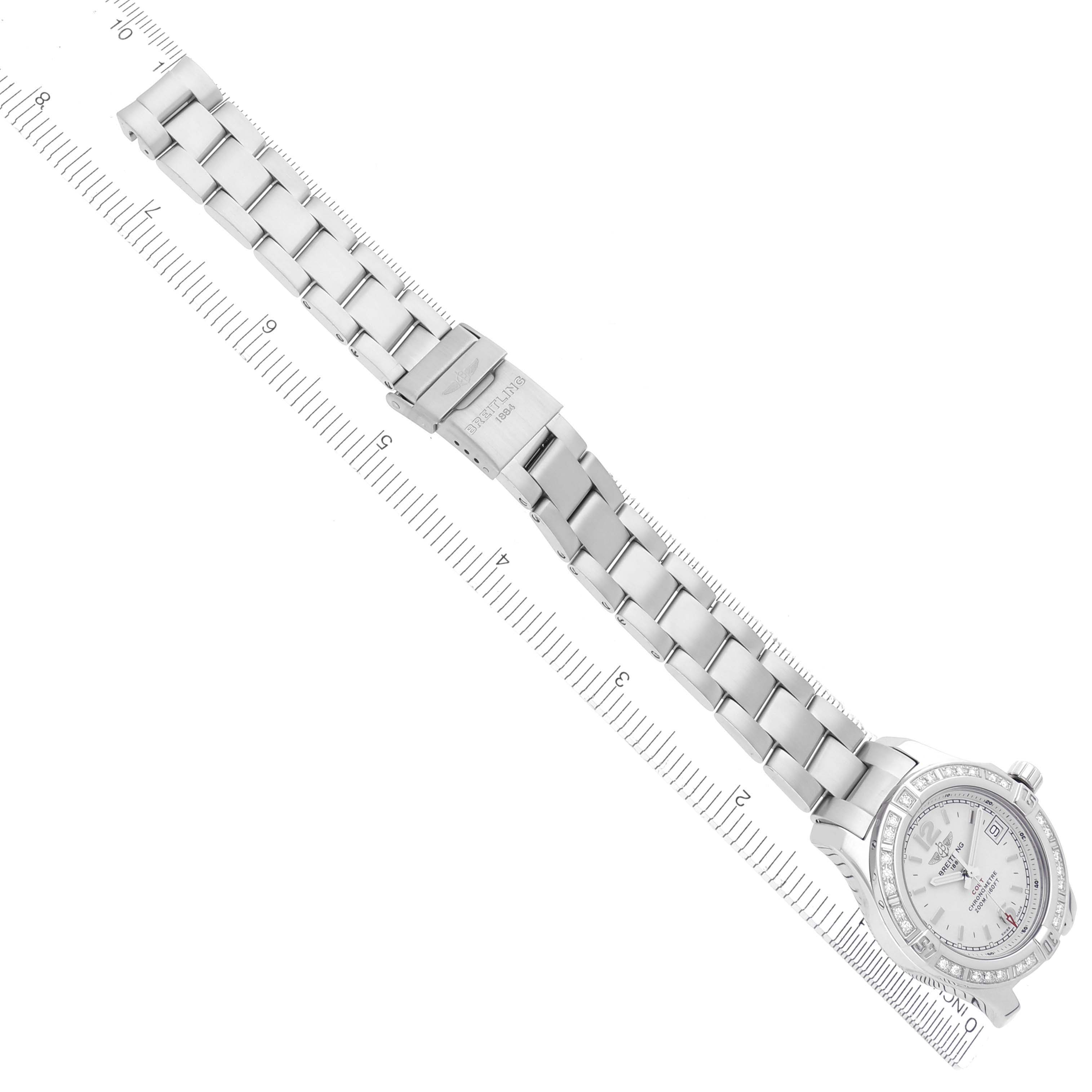 The Breitling A77388 Women's Stainless Steel Silver Dial A77388 Women's Stainless Steel Silver Dial Colt Lady A77388 watch is shown from a top-down angle, displaying the full bracelet, clasp, and diamond bezel.
