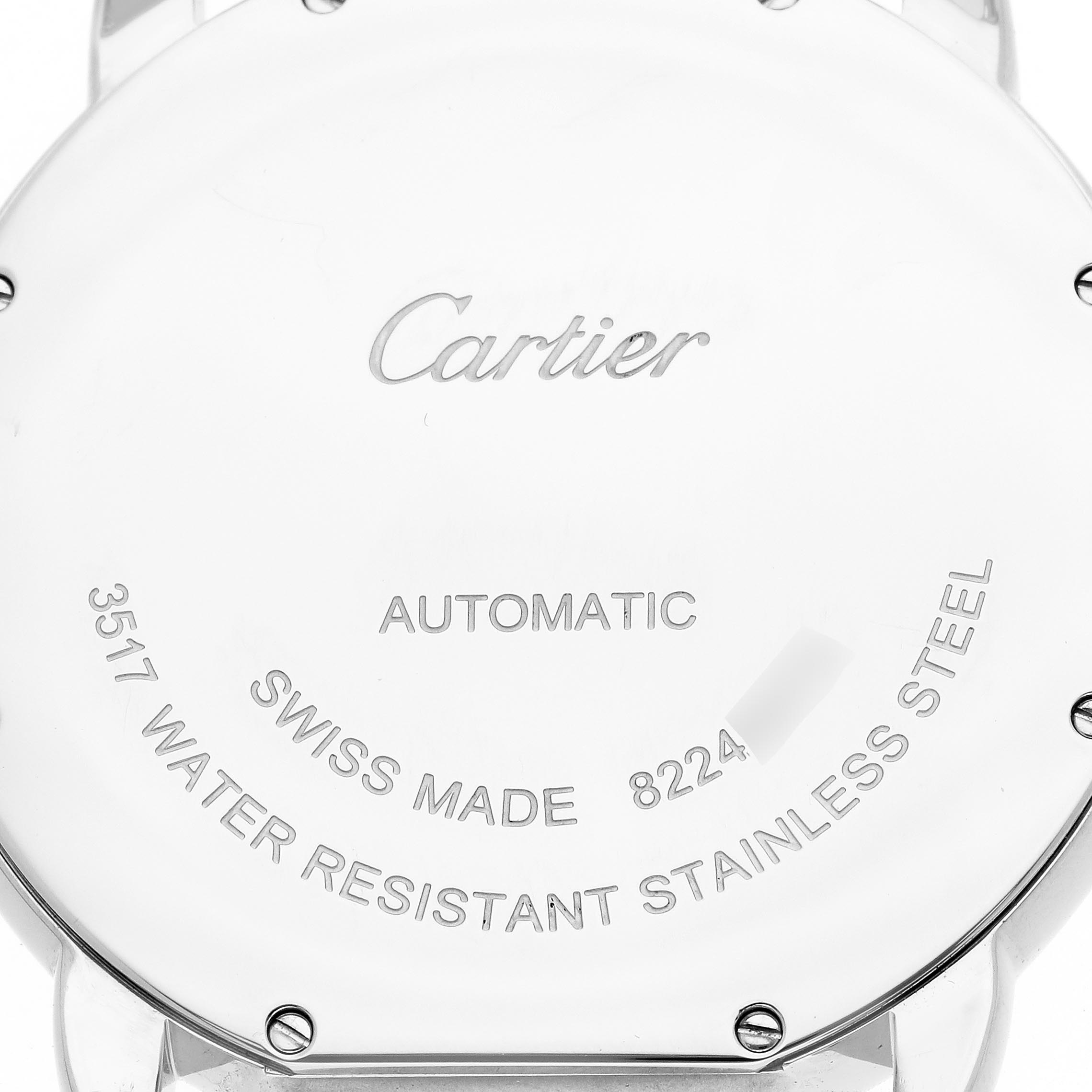 The image shows the back case of a Cartier Ronde W6701011 Men's Stainless Steel Silver Dial W6701011 Men's Stainless Steel Silver Dial watch with inscriptions about its features and origin.