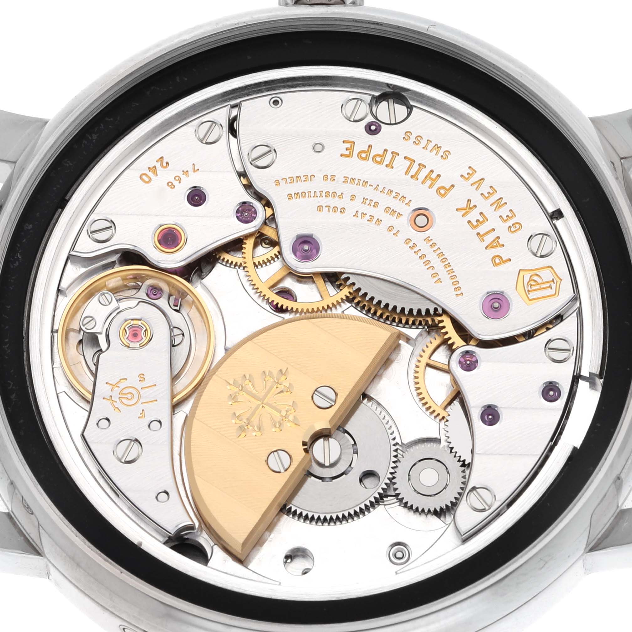 The image shows the back view of the Patek Philippe Calatrava 5057G-010 Men's White Gold Grey Dial 5057G-010 Men's White Gold Grey Dial, highlighting its intricate movement and gears.