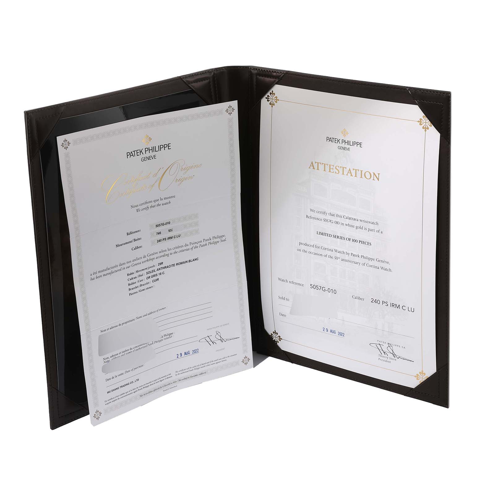 The image shows certificates of authenticity and attestation for a Calatrava model by Patek Philippe inside a display folder.