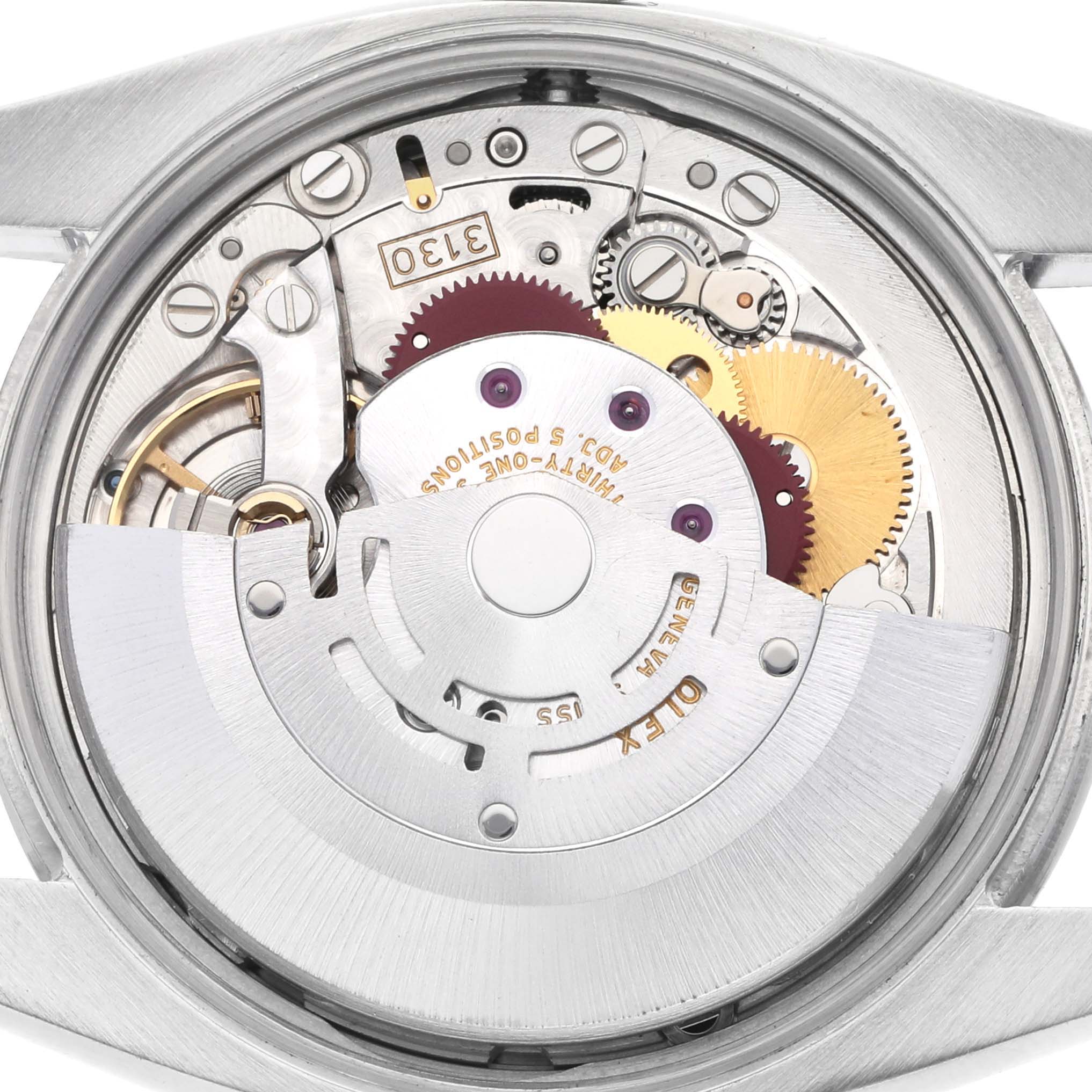 The image shows the movement of a Rolex Air-King 114200 Men's Stainless Steel White Dial 114200 Men's Stainless Steel White Dial watch from a rear angle, highlighting gears and components inside the casing.