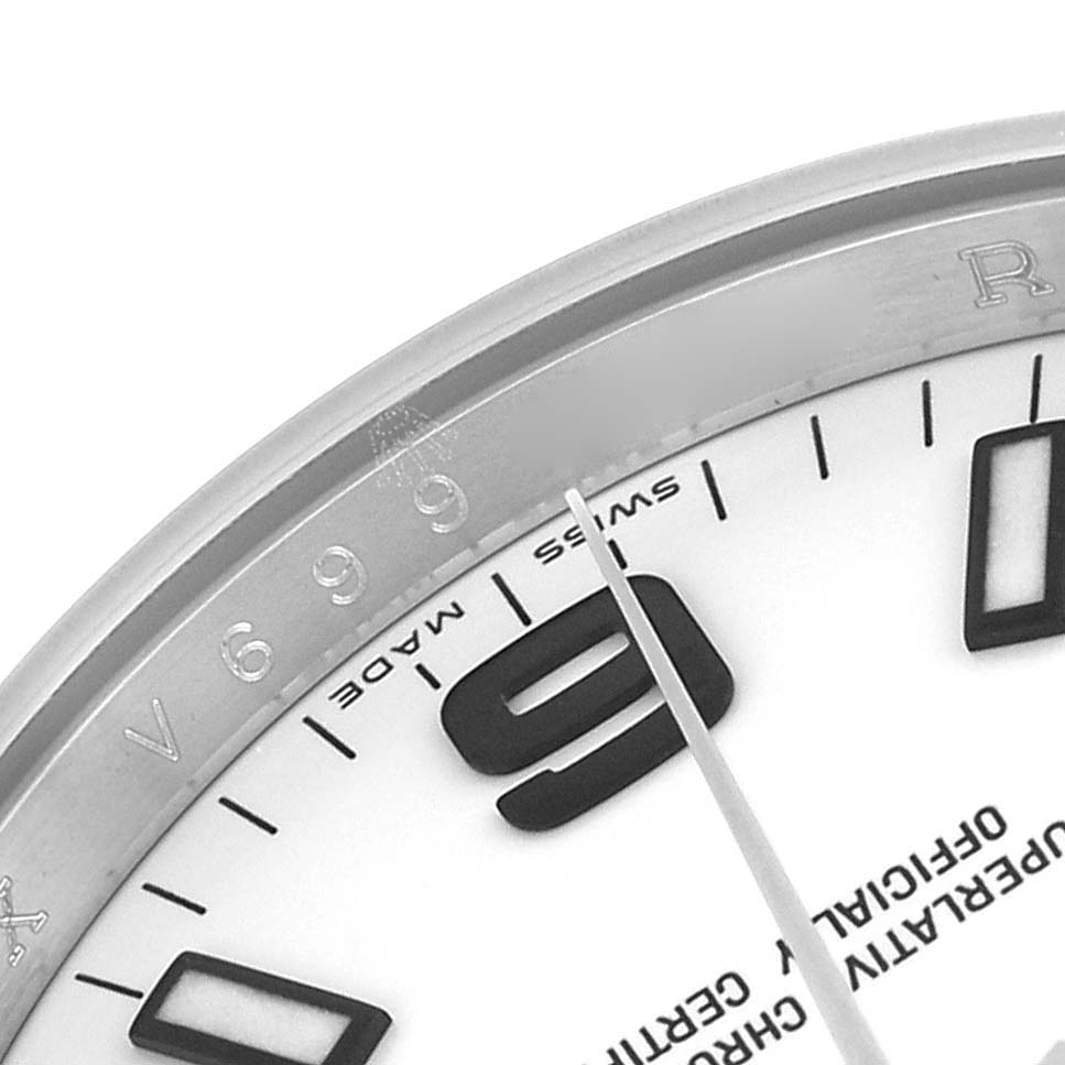 The image shows a close-up of the dial and bezel with markings of a Rolex Air-King 114200 Men's Stainless Steel White Dial 114200 Men's Stainless Steel White Dial watch.