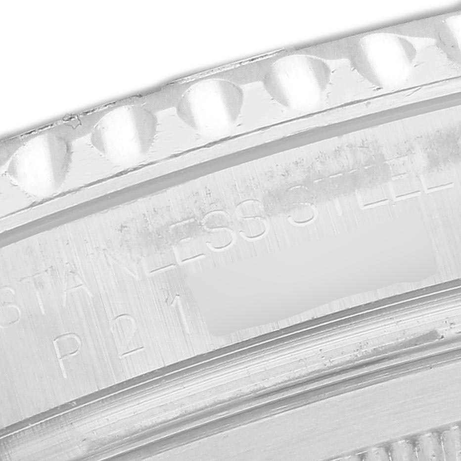 The image shows a close-up of the Rolex Yacht-Master 16622 Men's Stainless Steel Silver Dial 16622 Men's Stainless Steel Silver Dial's engraved details on the stainless steel case back.