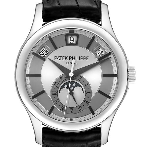 The image shows a Patek Philippe Complications 5205G-001 Men's White Gold Silver Dial 5205G-001 Men's White Gold Silver Dial watch, displaying its face, crown, and part of the leather strap, with calendar and moon phase complications.