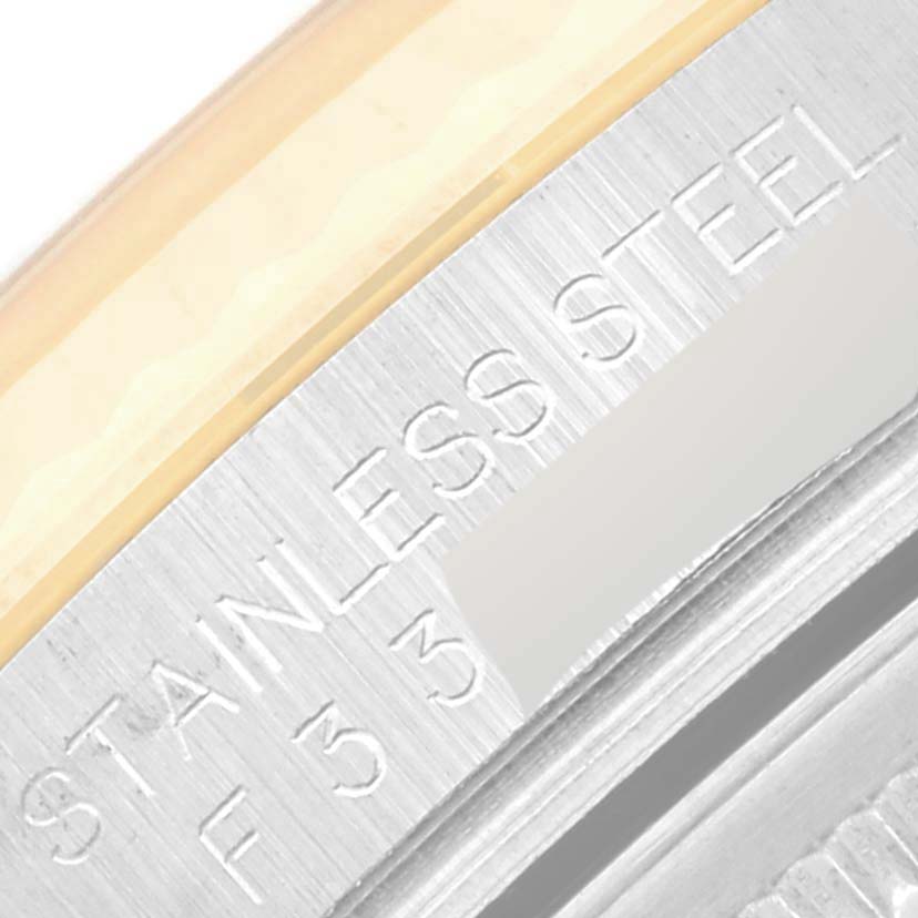 This close-up image shows part of the caseback engraving on a Rolex Datejust 116233 Men's Steel and Gold (two tone) Silver Dial 116233 Men's Steel and Gold (two tone) Silver Dial, highlighting the "STAINLESS STEEL" text.