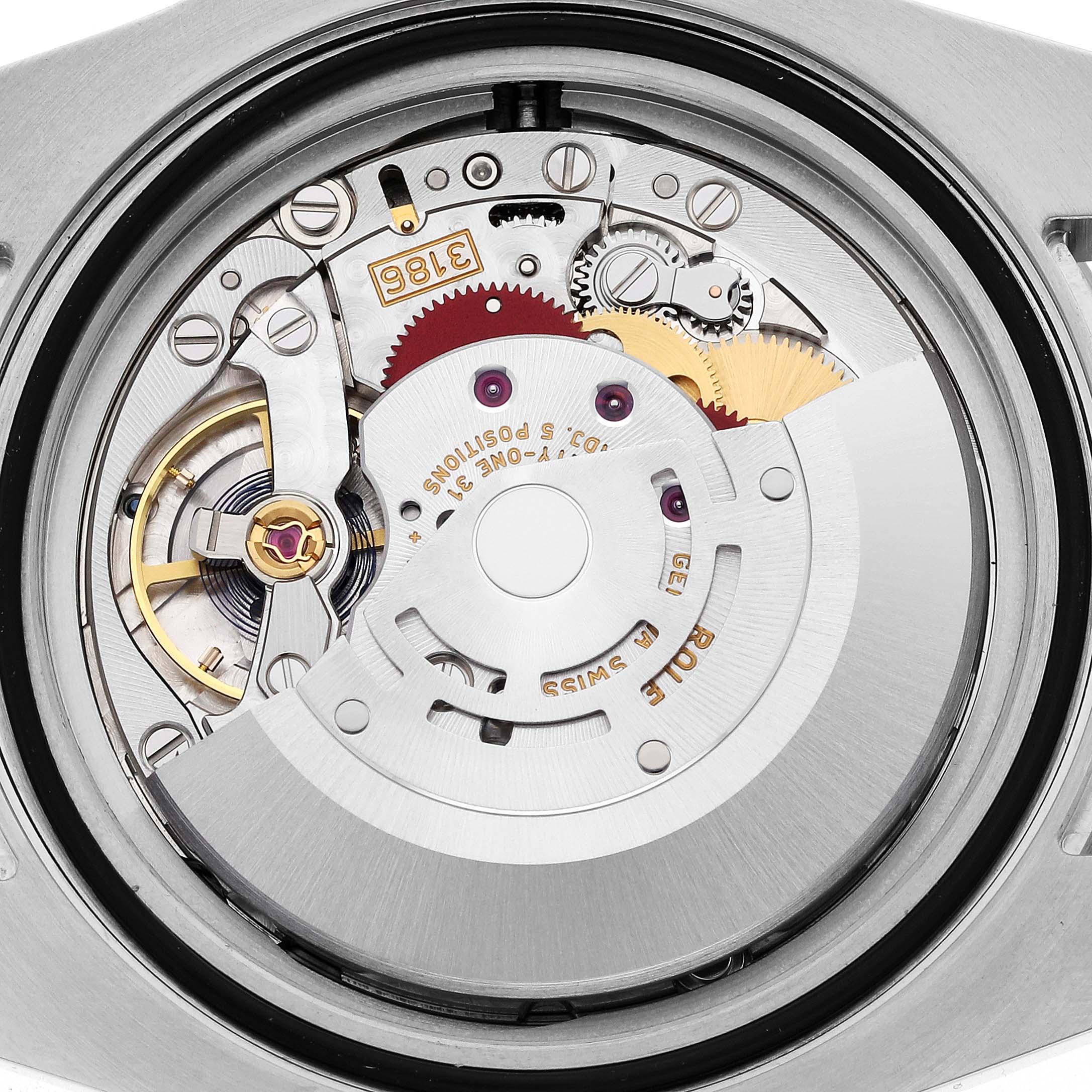 This image shows the intricate internal movement mechanism of a Rolex GMT-Master 116713 Men's Steel and Gold (two tone) Black Dial 116713 Men's Steel and Gold (two tone) Black Dial watch.