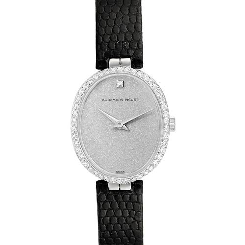 The image shows a front view of a Vintage Audemars Piguet watch with an oval face, diamond bezel, and black strap.