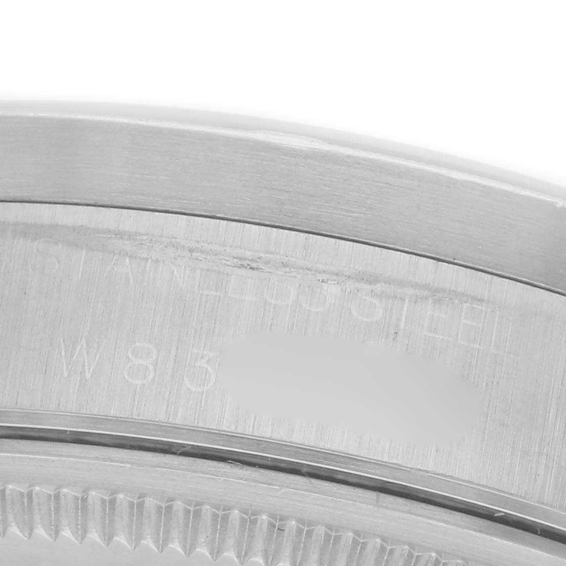 The image shows a close-up of the stainless steel bezel and part of the case edge of a Rolex Air-King 14010 Men's Stainless Steel Silver Dial 14010 Men's Stainless Steel Silver Dial watch.