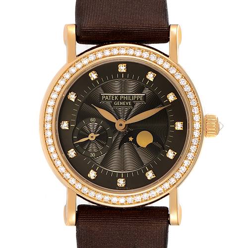 The Patek Philippe Calatrava 4858J-010 Women's Yellow Gold Brown Dial 4858J-010 Women's Yellow Gold Brown Dial watch is shown from the front, featuring a black dial, diamond bezel, and gold case with a brown strap.