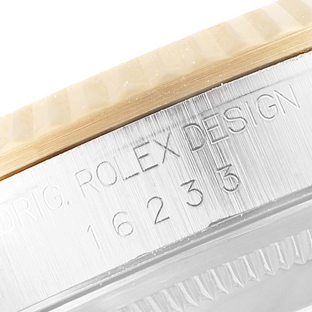 This close-up photo shows the side casing of a Rolex Datejust 16233 Men's Steel and Gold (two tone) Grey Dial 16233 Men's Steel and Gold (two tone) Grey Dial watch, highlighting the model number 16233 and part of the bezel.