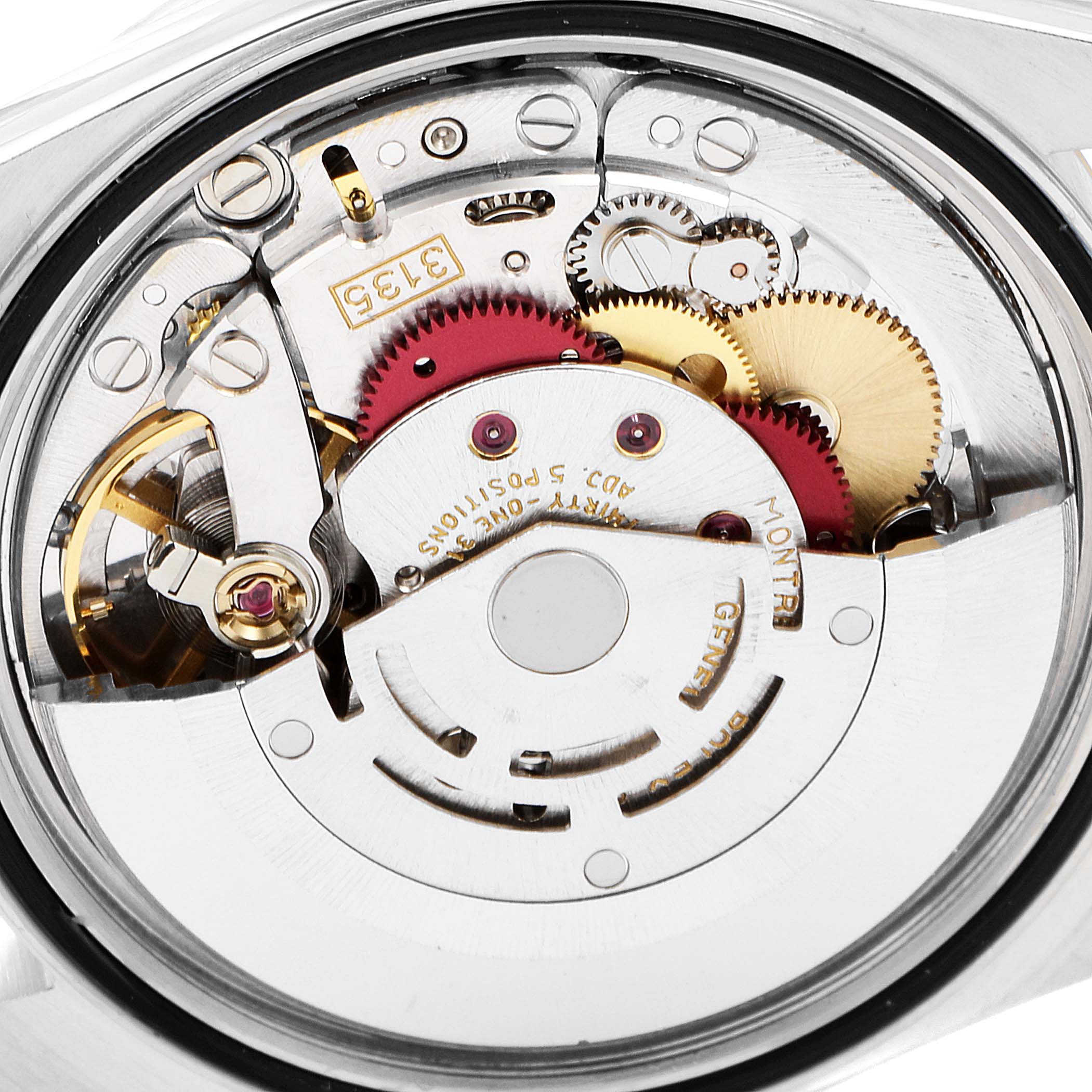 This is an internal view of the Rolex Datejust 16233 Men's Steel and Gold (two tone) Grey Dial 16233 Men's Steel and Gold (two tone) Grey Dial showing the intricate mechanical movement and gears.