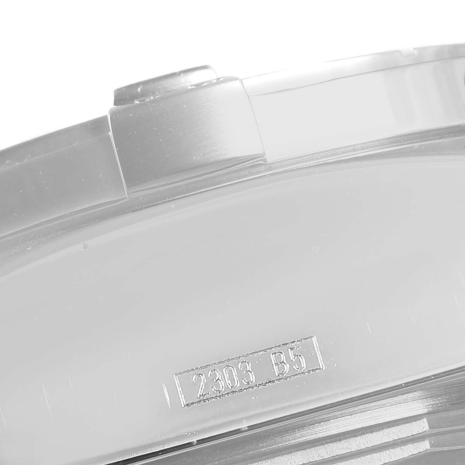This image shows a close-up of the side of an Avenger watch by Breitling, highlighting the bezel and a visible serial number.
