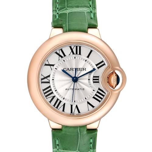 The image shows a front view of a Ballon Bleu de Cartier watch with a green strap and a rose gold case.