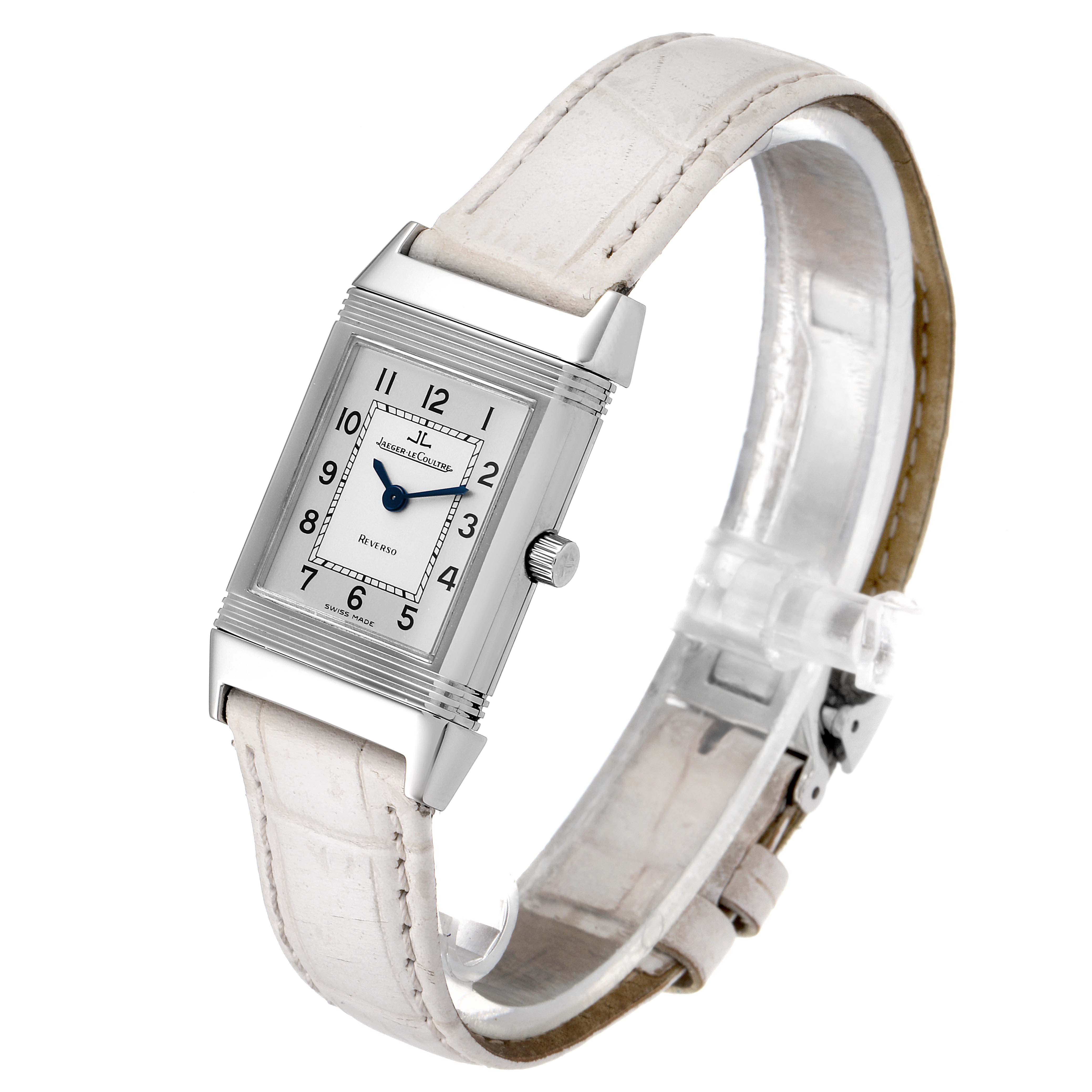 The Jaeger LeCoultre Reverso 260.8.08 Women's Stainless Steel Silver Dial 260.8.08 Women's Stainless Steel Silver Dial watch is shown at a three-quarter angle, highlighting its rectangular face, white strap, and crown.