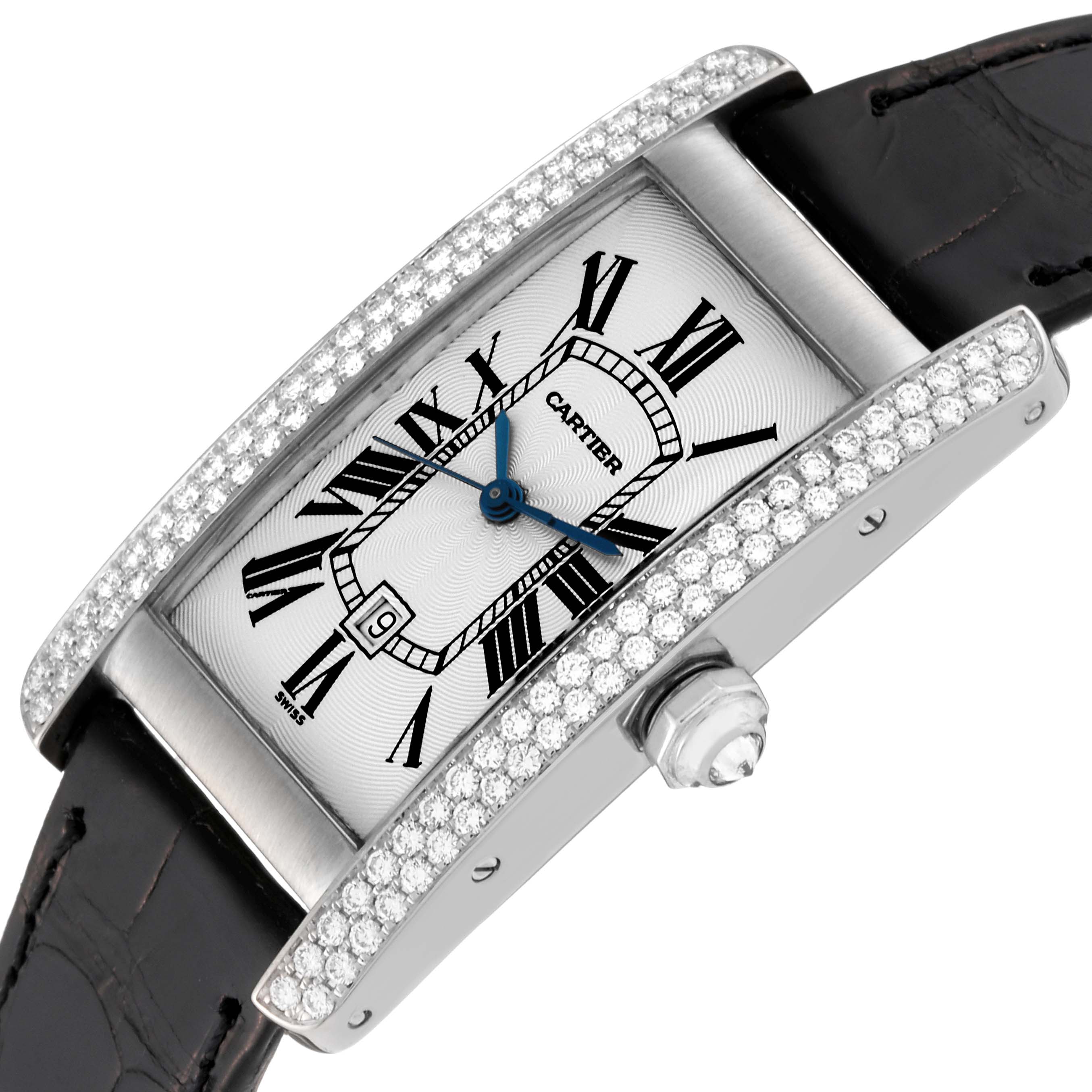The Cartier Tank Americaine WB702651 Women's White Gold Silver Dial WB702651 Women's White Gold Silver Dial watch is shown at an oblique angle, highlighting its diamond bezel, crown, and leather strap.