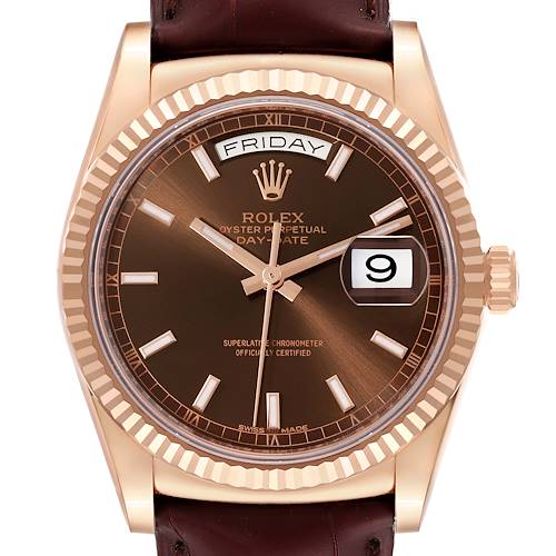 The image shows a frontal view of a Rolex President 118135 Men's Rose Gold Brown Dial 118135 Men's Rose Gold Brown Dial model watch, highlighting its brown dial, date, and day indicators.