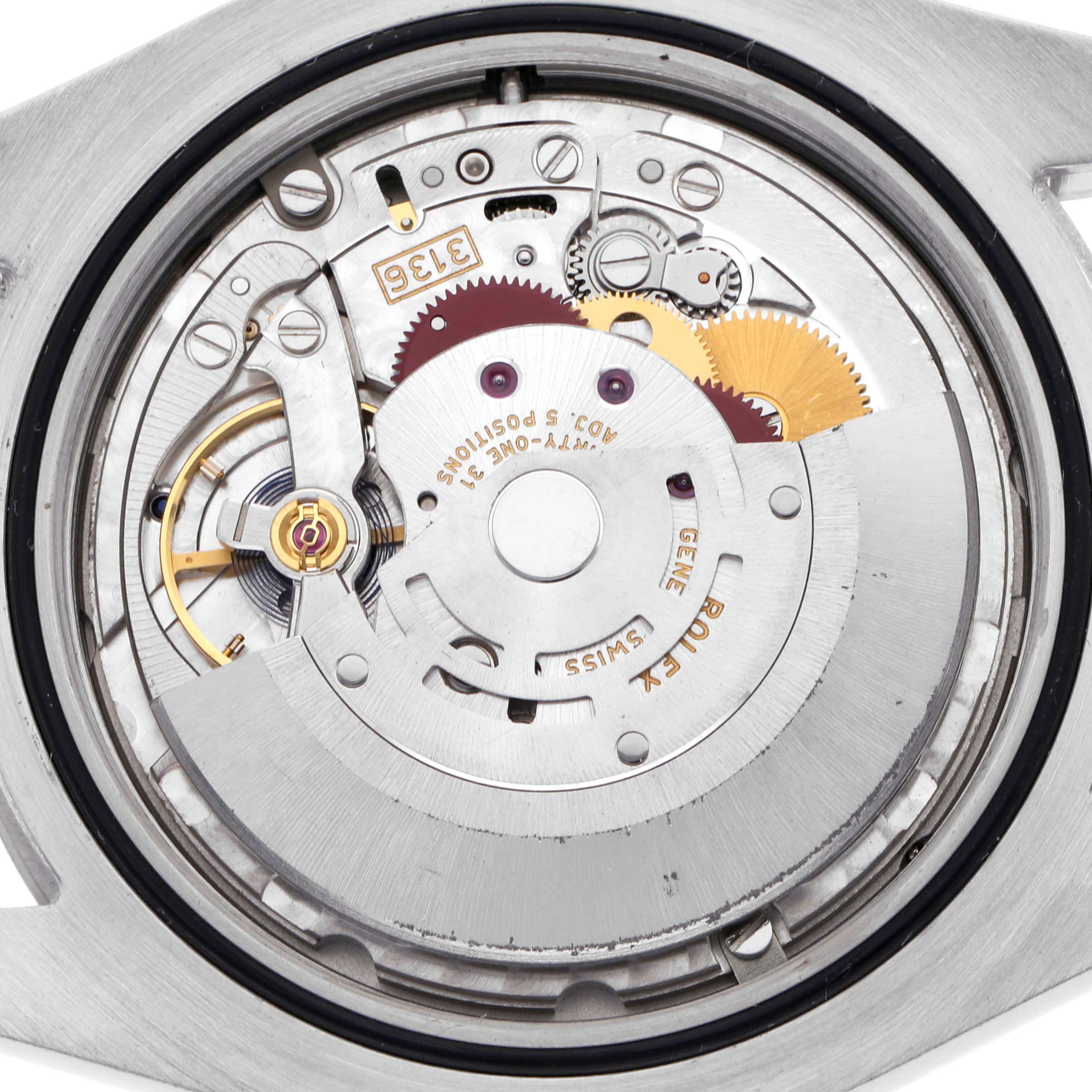 The image shows the movement of a Rolex Datejust 41 116334 Men's Stainless Steel Silver Dial 116334 Men's Stainless Steel Silver Dial, focusing on its intricate gears and rotor mechanism.
