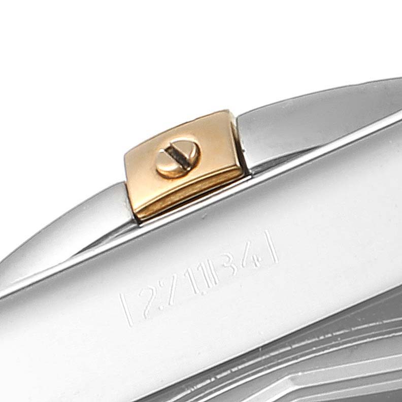 This close-up shows a part of the case and a gold screw detail from a Breitling Chronomat IB0110 Men's Stainless Steel Silver Dial IB0110 Men's Stainless Steel Silver Dial watch.