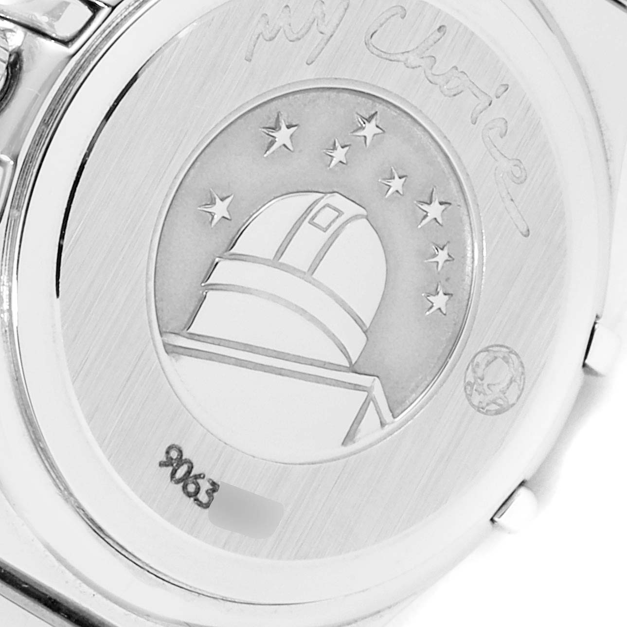 The image shows the back case of the Omega 1465.79.00 Women's Stainless Steel Mother of Pearl Dial 1465.79.00 Women's Stainless Steel Mother of Pearl Dial Constellation Iris My Choice Steel Multi Stone Ladies Watch 1465.79.00, featuring engraved details.