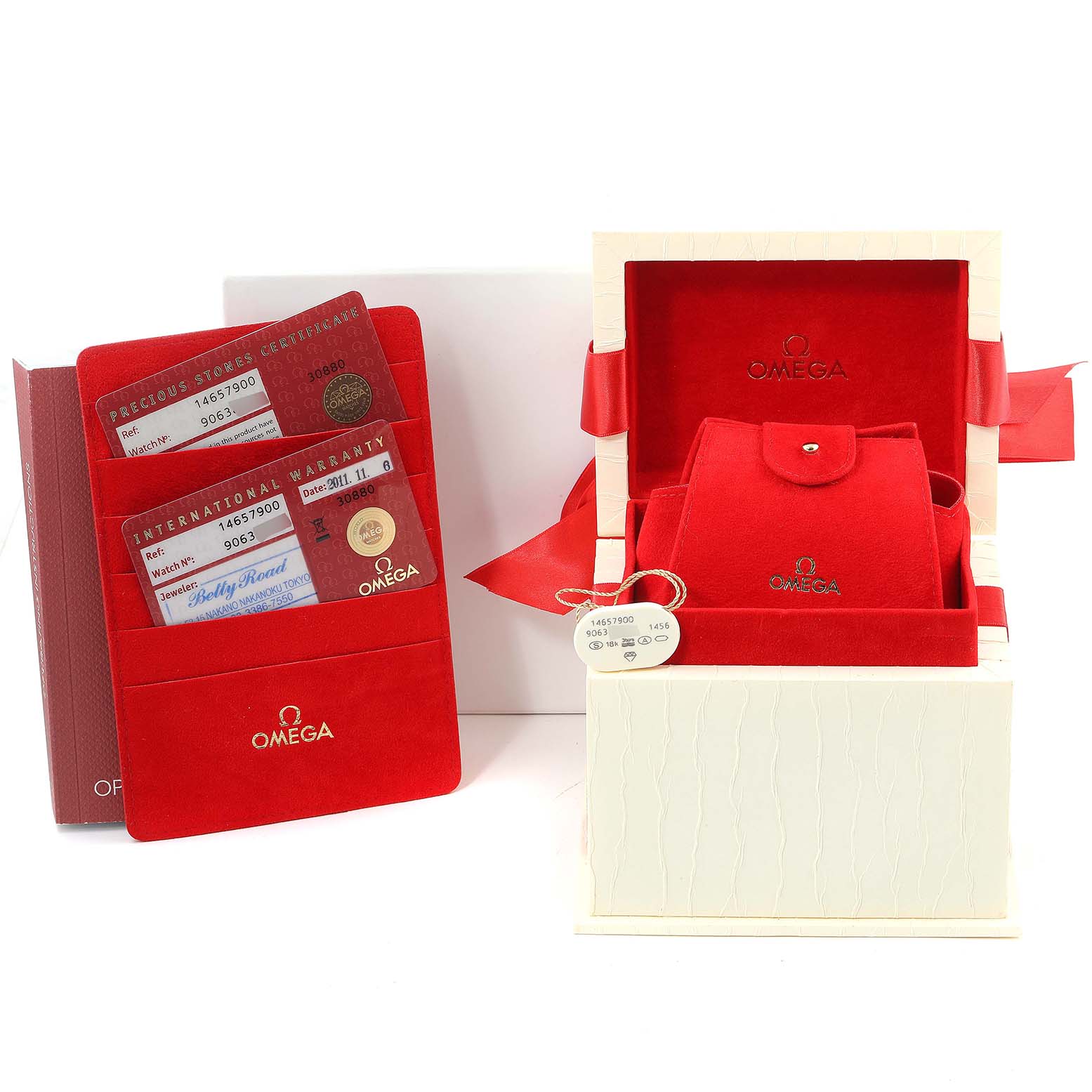 The image shows the packaging and accessories of the Omega 1465.79.00 Women's Stainless Steel Mother of Pearl Dial 1465.79.00 Women's Stainless Steel Mother of Pearl Dial Constellation Iris My Choice Steel Multi Stone Ladies Watch 1465.79.00, including its box, warranty cards, and a watch pouch.