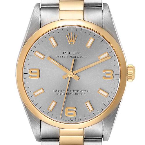 The image shows a front view of a Rolex Oyster Perpetual 14203 Men's Steel and Gold (two tone) Grey Dial 14203 Men's Steel and Gold (two tone) Grey Dial watch, highlighting its dial, hands, hour markers, bezel, and part of the bracelet.