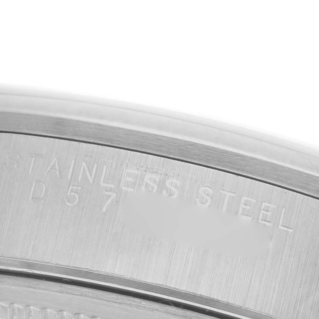 The image shows a close-up of the engraved stainless steel part on the back of a Rolex Date 15200 Men's Stainless Steel Blue Dial 15200 Men's Stainless Steel Blue Dial model.