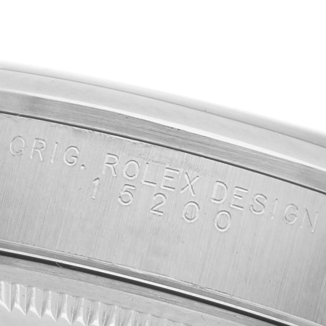 The image shows the side engraving of the case on a Rolex Date 15200 Men's Stainless Steel Blue Dial 15200 Men's Stainless Steel Blue Dial model, focusing on the "ORIG. ROLEX DESIGN" and model number.