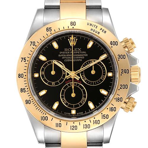 The image shows a front view of a Rolex Daytona 116523 Men's Steel and Gold (two tone) Black Dial 116523 Men's Steel and Gold (two tone) Black Dial watch, displaying its gold bezel, black dial, and chronograph subdials.