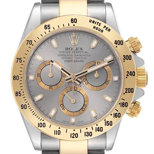 The Rolex Daytona 116523 Men's Steel and Gold (two tone) Grey Dial 116523 Men's Steel and Gold (two tone) Grey Dial watch is shown from the front, highlighting its gold bezel, chronograph dials, and pushers.
