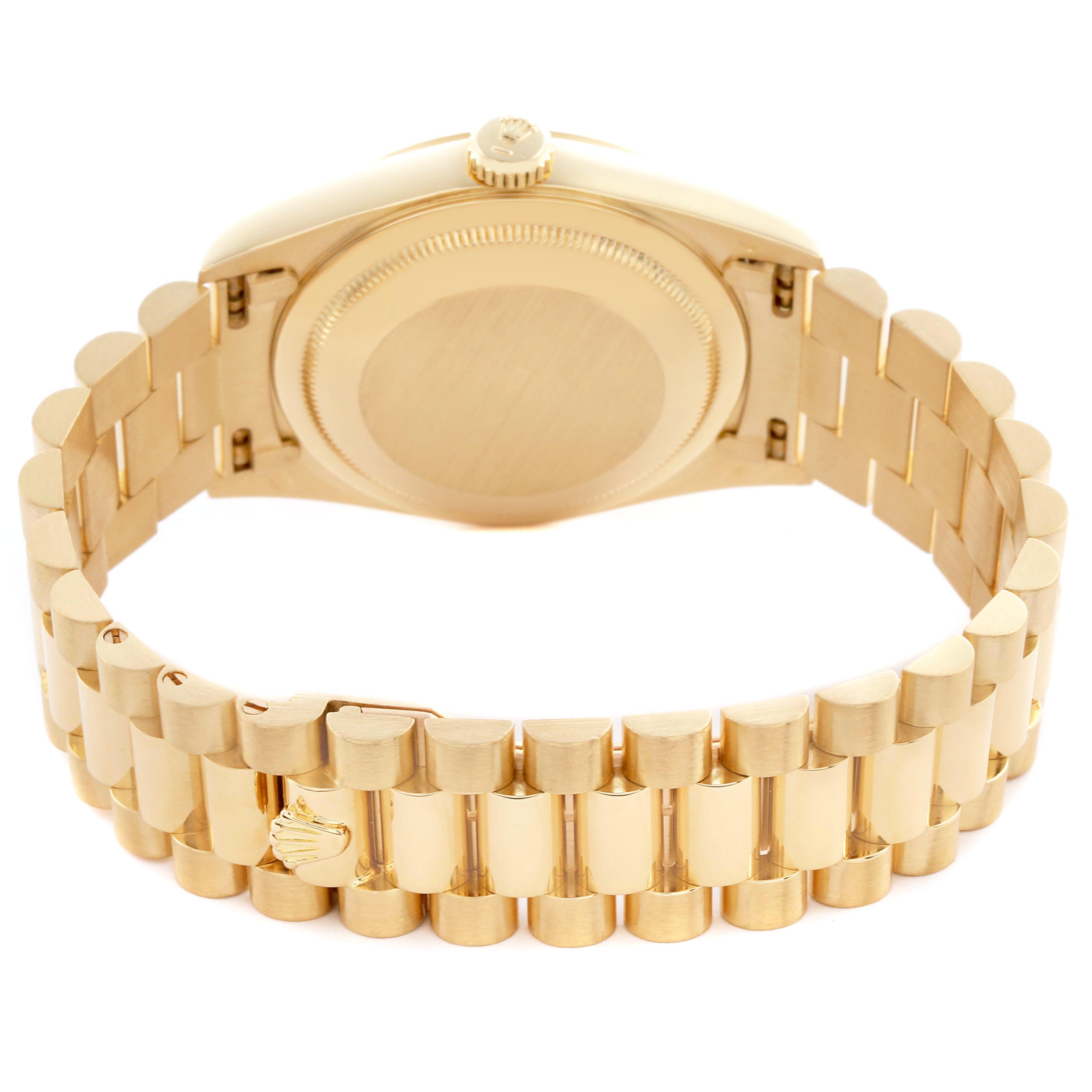 The Rolex President 18238 Men's Yellow Gold Champagne Dial 18238 Men's Yellow Gold Champagne Dial model watch is shown from the back, highlighting the bracelet, clasp, and case back.