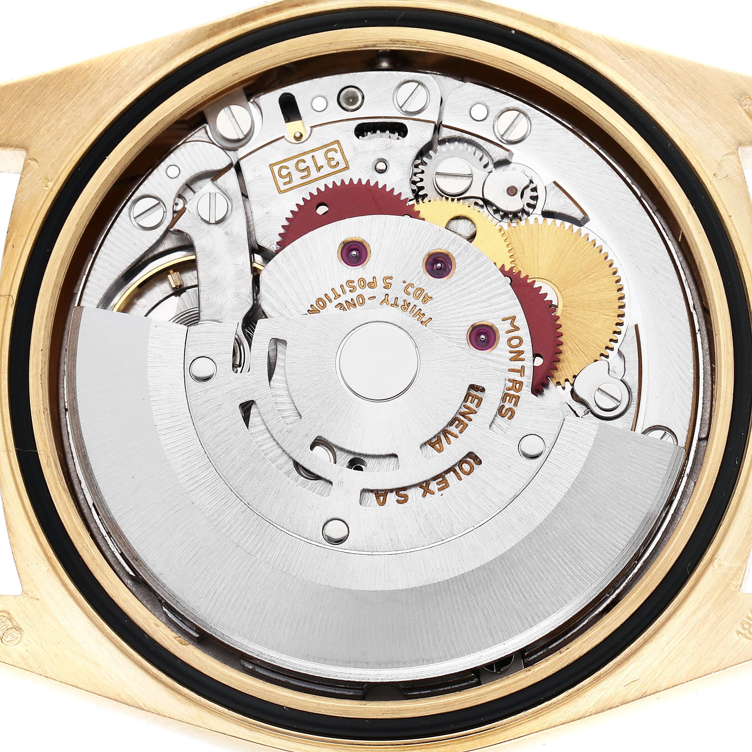The image shows the movement mechanism of a Rolex President 18238 Men's Yellow Gold Champagne Dial 18238 Men's Yellow Gold Champagne Dial watch from a top-down angle, highlighting gears and components.