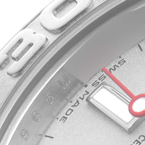 The image shows a close-up of the Rolex Yacht-Master 169622 Women's Stainless Steel Silver Dial 169622 Women's Stainless Steel Silver Dial watch's bezel, part of the dial, and the tip of a hand.