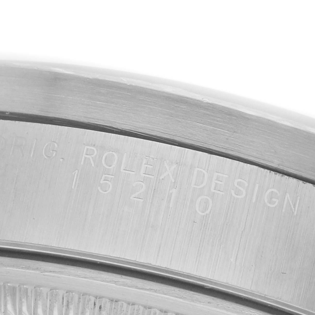 The image shows a close-up of the serial engraving on the case side of a Rolex Date 15210 Men's Stainless Steel Silver Dial 15210 Men's Stainless Steel Silver Dial model watch.