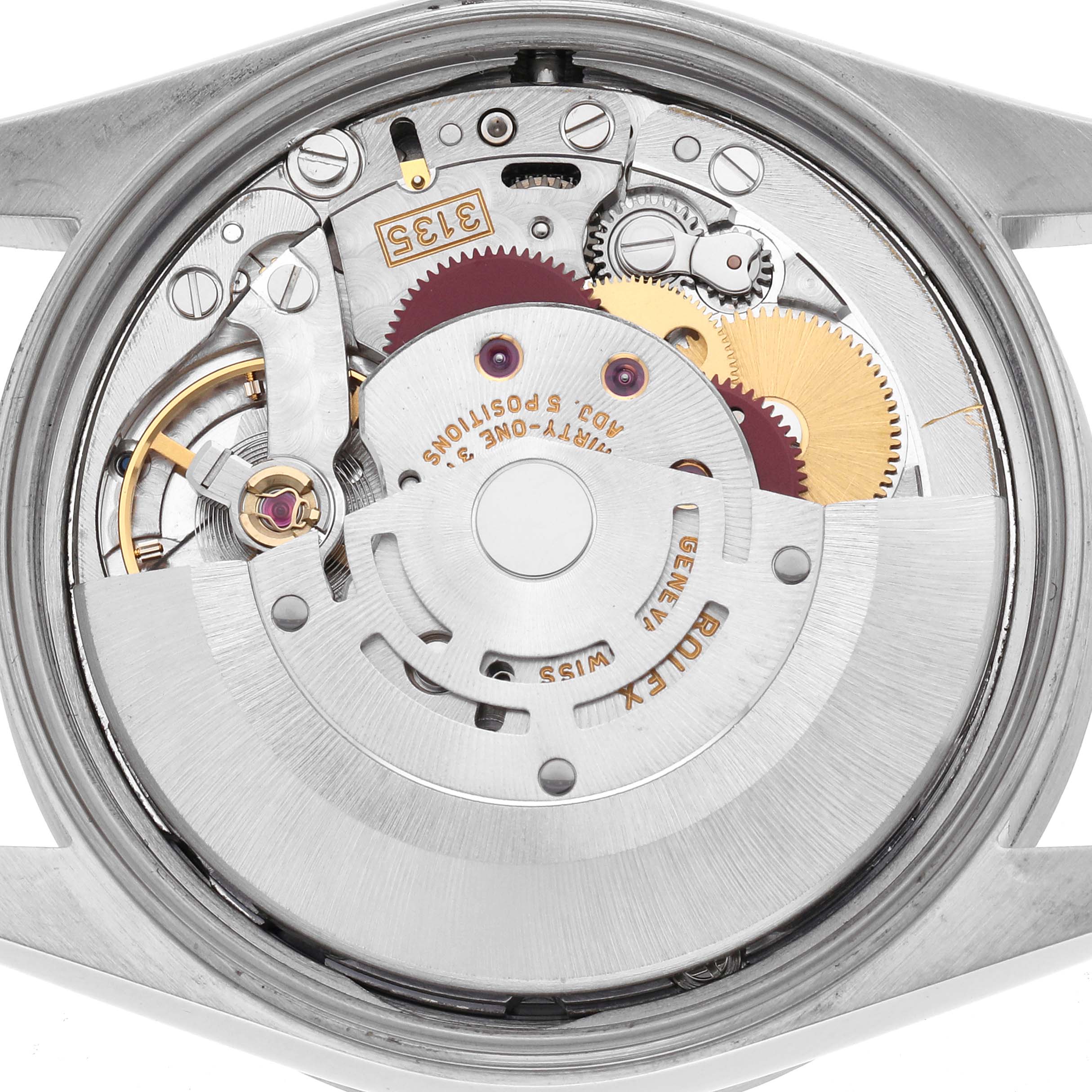 The image shows the movement of a Rolex Date 15210 Men's Stainless Steel Silver Dial 15210 Men's Stainless Steel Silver Dial watch from a back view, highlighting its intricate gears and rotor.