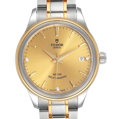 The image shows a front view of a Tudor Style M12303 Women's Steel and Gold (two tone) Champagne Dial M12303 Women's Steel and Gold (two tone) Champagne Dial model watch, featuring a gold dial, date window, and bi-color metal bracelet.