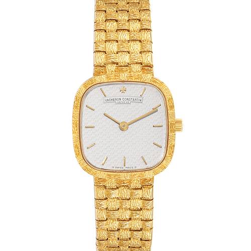 This image shows a front view of a Vintage Vacheron Constantin watch with a gold textured band and a rectangular gold case.