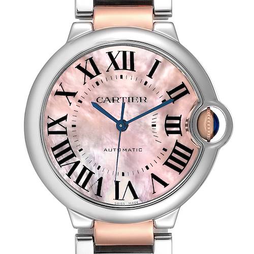 The image shows a frontal view of a Ballon Bleu de Cartier watch, highlighting its pink mother-of-pearl dial and signature blue hands.