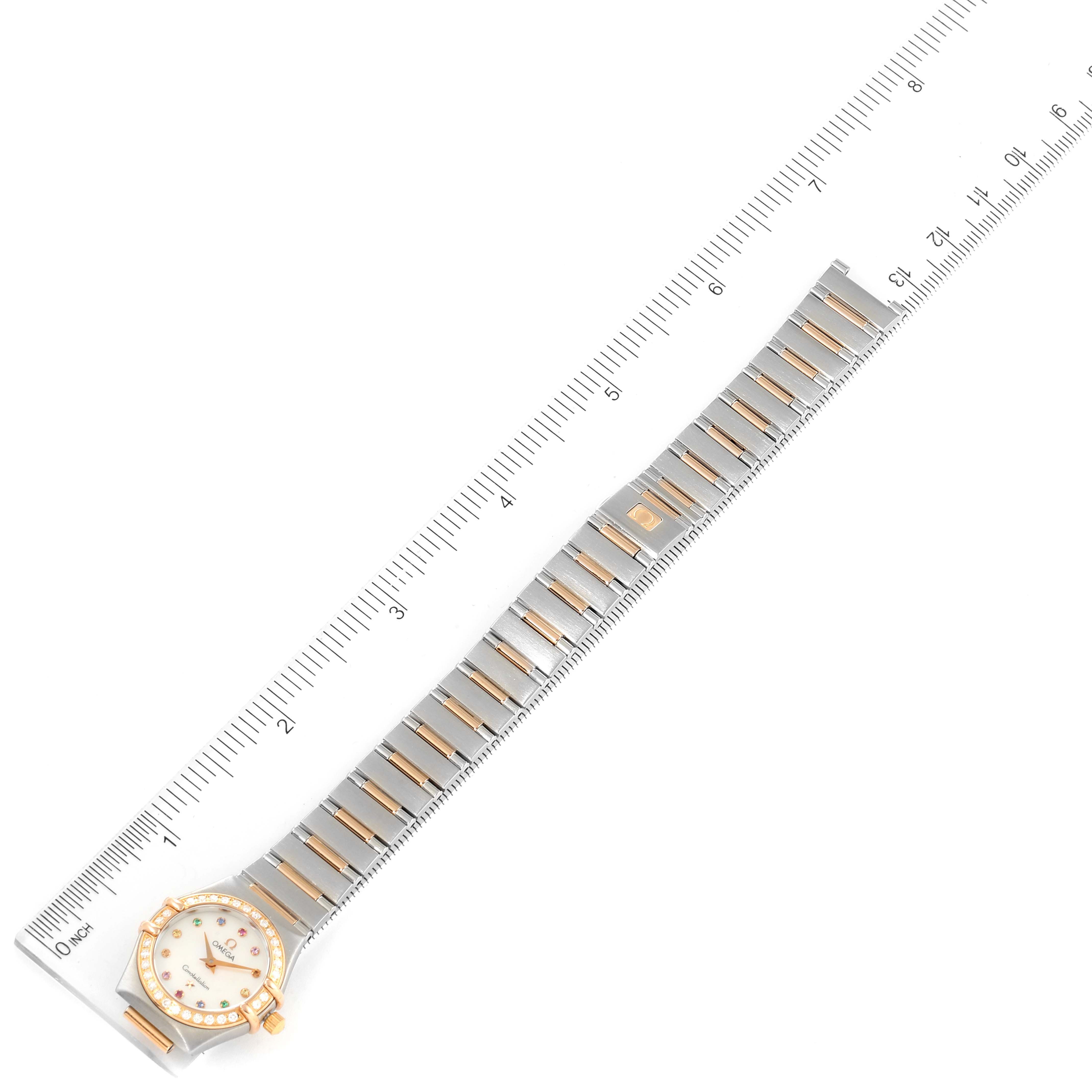 The image shows a top-down view of the Omega 1360.79.00 Women's Steel and Gold (two tone) Mother of Pearl Dial 1360.79.00 Women's Steel and Gold (two tone) Mother of Pearl Dial Constellation Iris Steel Rose Gold Mother of Pearl Ladies Watch 1360.79.00 alongside a ruler for scale.