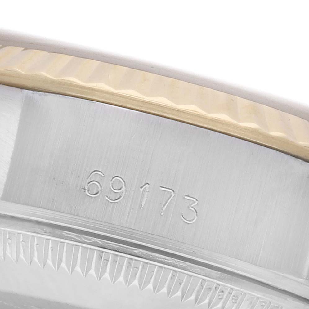 The image shows a close-up of the side of a Rolex Datejust 69173 Women's Steel and Gold (two tone) Champagne Dial 69173 Women's Steel and Gold (two tone) Champagne Dial, highlighting the model number and the edge of the bezel.